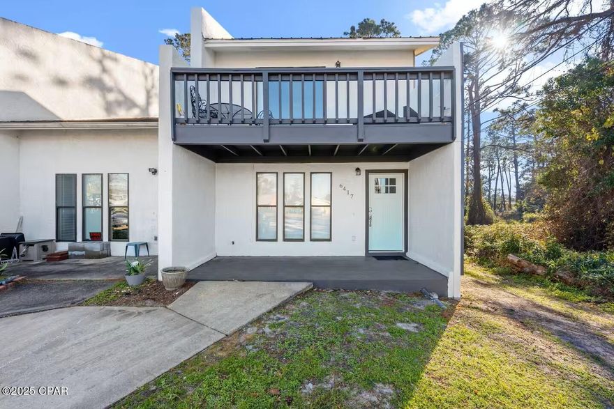 Settle into comfort and convenience with this fully furnished, long-term rental townhome, perfectly located in a quiet neighborhood near the best of Panama City Beach. Designed for easy living, this two-story home offers the ideal blend of space, privacy, and coastal lifestyle—whether you're relocating, working remotely, or simply ready to enjoy beach life year-round.

Just a 5-minute drive to St. Andrews State Park and nearby beach access, you'll also be moments from local marinas where you can rent jet skis, pontoon boats, or book a deep-sea fishing trip. Enjoy some of the area's favorite restaurants, bars, and entertainment just blocks away, all while coming home to a peaceful retreat.

Inside, the home is thoughtfully furnished and move-in ready. Both bedrooms and the full bath are located upstairs, offering privacy and separation from the living areas. The primary bedroom features a comfortable queen bed, Roku TV, dedicated workspace for those who work from home, and a private vanity. The second bedroom includes two twin beds, its own Roku TV, and vanity—perfect for guests or family. A queen sleeper sofa with a brand-new gel foam mattress provides additional flexibility.

The kitchen includes a convenient laundry area stocked with beach towels, toys, and outdoor games. Step outside to your private, fenced backyard with patio—ideal for relaxing after a beach day.

Comfortable, well-equipped, and close to everything that makes Panama City Beach special—this furnished townhome is ready to welcome you home.