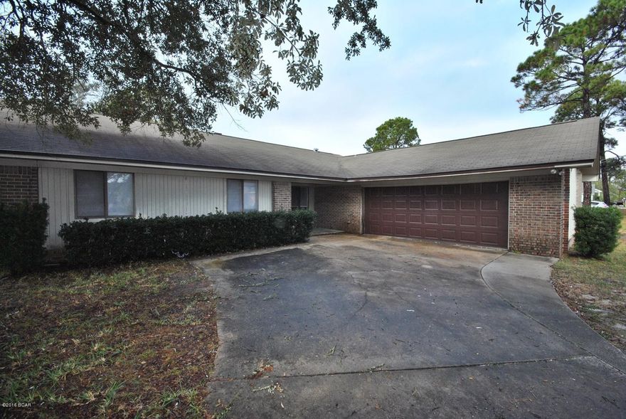 North Lagoon, a well known, attractive area located at the east end of Panama City Beach. The home features brick, two car garage, closed in back porch and kitchen open to the living room. The subdivision has no hoa fees and the home does not require flood insurance. Updates include new paint and carpet within the past year. Close in proximity to the Lagoon, the Gulf and the Navy Base and several government contract companies. Come visit today!