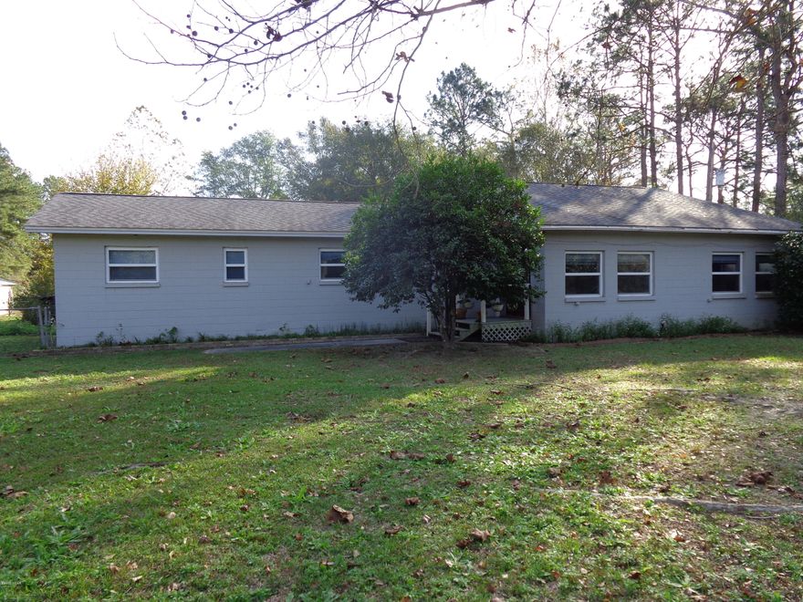 Very nice 3/2 on 2 acres.  Split bedroom plan.  Great condition.  Nice deck.  Also includes a barn with 2 horse stalls and 2-car garage.  Entire property is fenced.  The home's pantry also doubles as a safe room with concrete walls in case of storms. Lock box is on the front door. Move in ready. All measurements are approximate.  Please verify is important.