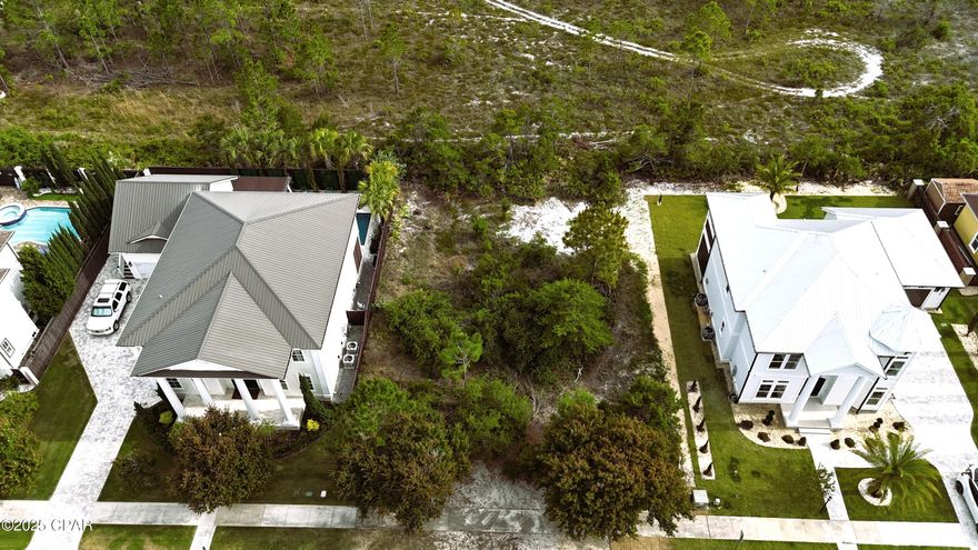 Build your dream home in the heart of Panama City Beach! This centrally located 80x100 lot is perfectly positioned in the highly desirable Tapestry Park community—just across the street from Hutchison Beach Elementary and only two blocks from beach access #43.

Tapestry Park blends Old Florida charm with modern convenience, offering underground utilities, vintage-style lamp posts, and a thoughtful layout filled with amenities. Enjoy access to a resort-style community pool, full-size tennis and basketball courts, a clubhouse with a community room and conference space, and beautifully maintained common areas for gathering and play.

Located just minutes from Pier Park, shopping, dining, and entertainment are always within easy reach. Come explore this exceptional neighborhood and see why so many are choosing to call Tapestry Park home.