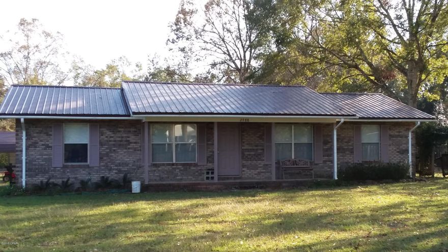 Well maintained 4 bedroom, 2 bath brick home on paved road only 2 miles from Interstate 10. Beautiful front and back yards on this over sized 3/4-acre corner lot. Split bedrooms and metal roof with covered front porch. Wood laminate flooring in the living room & carpeted bedrooms. Eat-at bar in kitchen plus dining area with 8' wall of extra storage. Garage has been converted into a bonus room with French doors. There is a culvert in place on Sand Path Rd that is not in use. Concrete parking & carport on Comet Ln plus a concrete slab outside the bonus room. Inside laundry room with storage. Within minutes of Doctors Memorial Hospital and Chipley, FL. Convenient to Bay County Intl Airport & Panama City Beach. Nice, clean home!