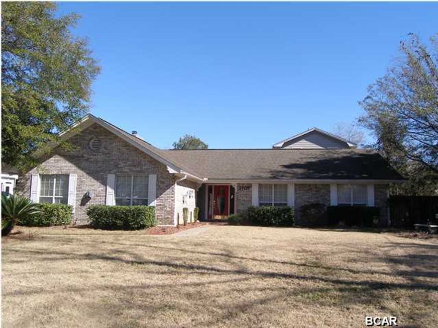 Looking for a large home in the heart of Lynn Haven? Look no further! Large living room, spacious kitchen and breakfast area, formal dining or sitting area, wood burning fireplace, split bedroom plan. Lots of cabinets and closet space through-out the house. Downstairs has 3 bedrooms and 2 full baths, Large Game Room / Man Cave with separate bar and room for pool table. Upstairs has a large master suite with grand master bath with garden whirlpool tub and TV, large craft room / office and lots of privacy. Completely remodeled with new large addition in 2005 including roof and both a/c. Detached 2 car garage, in-ground pool with solar heating system, deck, 2 covered patios, playground and lots of driveway room. 2 water heaters and 2 ac systems (with 3 zones.) This home has over 3200