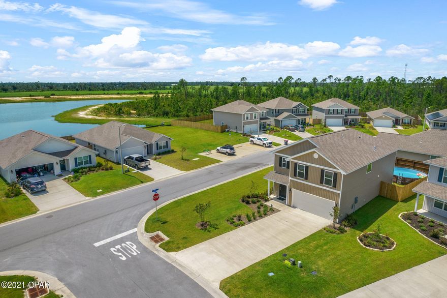 This spacious, pristine house is just like new! It's only been lived in for 5 months, quite a deal! They have added a full privacy fence and ceiling fans. Large corner lot, great back yard! This home features an extra bedroom downstairs, 4 bedrooms upstairs and a nice spacious living area. A Qualitair Air Purification System comes with the home. This is the Robie floorpan and will provide a lot of space for your family. There is a lovely view of the lake on property outside the bedroom window, so tranquil. Laundry room is upstairs by the majority of the bedrooms for convenience. Master bathroom has a shower and large tub, other 2 full bathrooms have a large shower. Also comes with Echo Dot, Kwikset  keyless entry and Skybell Doorbell. Schedule your showing today!!