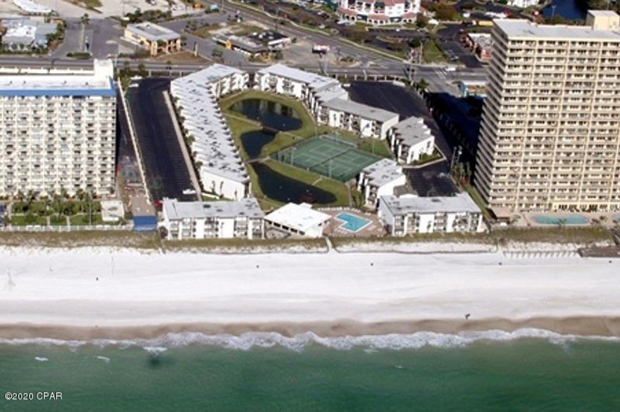 CURRENTLY UNDER CONTRACT, SELLER ACCEPTING BACKUP OFFERS. You'll love this 3 bedroom, 3 bath condo in Sugar Beach!  This two-story unit w/pond & gulf views is being sold furnished & rental ready!  Lots of living & sleeping space, ideal for 8+!  You need only bring your toothbrush, bathing suits & flip flops!  Sugar Beach is a gulf-front complex with dedicated beach, a pool, barbecue patios, private pond, resurfaced tennis/shuffleboard courts & the clubhouse has a 65'' TV, a ping-pong table & plenty of room for dinners with its own private kitchen.  Sugar Beach is walking distance to several restaurants &  family-oriented activities! The building has a new roof in 2019, 7 the unit has new mattresses in 2019 and new plank ceramic flooring in 2018. All info approx & must be verified by Buyer.