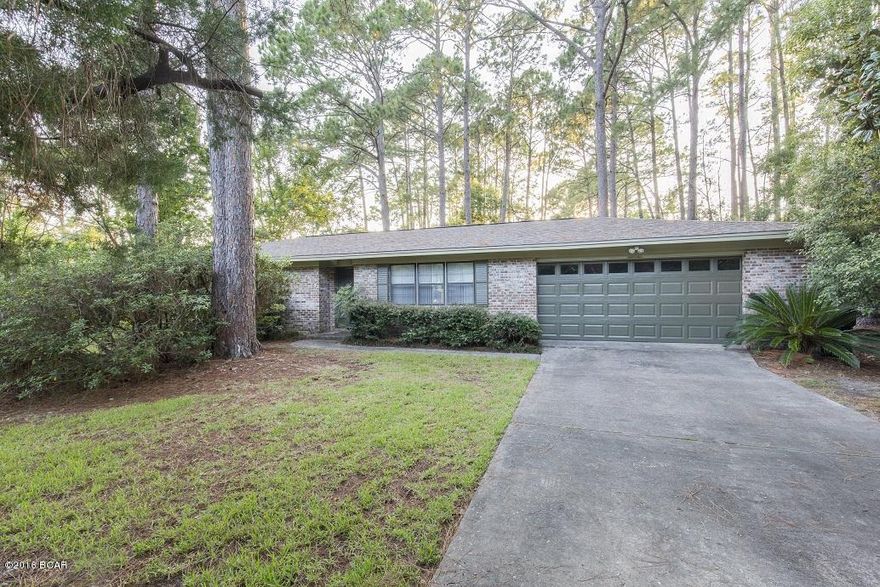 Motivated Seller! New Roof and new water heater in this 3 bed 2 bath all BRICK home with 2 car garage. Beautiful large Corner lot with lots of PRIVACY and TREES that provide shade and bird watching.  The house is ready to make someone a great home.  The home consists of a living room, dining room, kitchen, laundry room, master bedroom w/ bathroom, 2 additional bedrooms and an additional bathroom plus 2 car garage and a screened in back porch. Garage has plenty of storage. Lynn Haven schools (Lynn Haven Elem, Mowat Middle and Mosley High School), close to Kinsaul Park and the bay.  All measurements are approximate.  Please measure yourself for accuracy.  Home is in a VE Flood Zone.  Flood insurance is approximately $300 per month. Home Insurance is approximately $1400 per year.