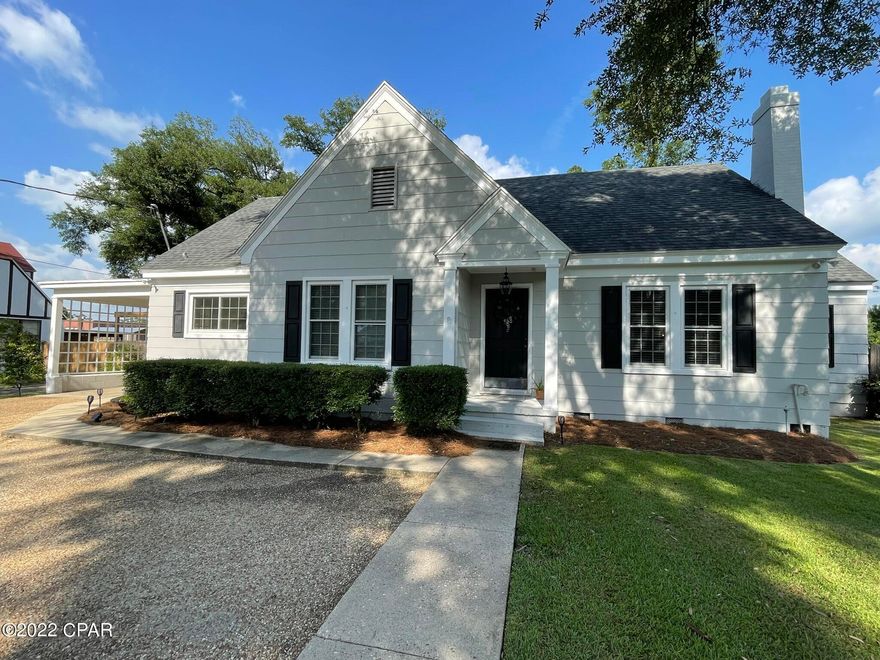 CURRENTLY UNDER CONTRACT, SELLER ACCEPTING BACKUP OFFERS' Turnkey 3 bedroom, 2 bathroom home in the heart of downtown Marianna. This home has plenty of old world charm with the convenience of modern updates! This home features original hardwood floors in the main living room, dining room and family room. The galley kitchen has plenty of cabinet space and updated appliances. The master has en suite bathroom with makeup vanity area. The other two bedrooms are on either side of the additional full bathroom. One of the bedrooms has a built in bookcase and desk area. The hall is spacious and has a laundry closet with shelving. The family room leads to the large back deck which is the perfect set up for grilling and entertaining. There is an attached carport with storage closet. The spacious ba The roof and HVAC were replaced in 2019. There is also a yard building that conveys with the property.