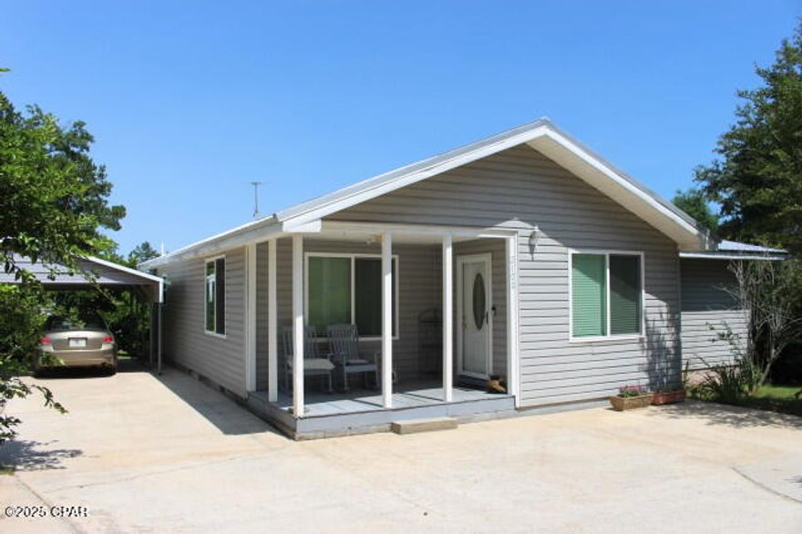 Welcome to this cozy 3-bedroom, 3-bath home in the heart of Sneads, just minutes from the serene Lake Seminole—perfect for boating and fishing enthusiasts, especially those who enjoy the area's popular fishing tournaments. Nestled on a beautifully landscaped 1-acre MOL lot, this home boasts an array of fruit trees and flowering bushes, creating a peaceful retreat. The large garage/workshop with its own access from Pope Street provides ample space for projects and storage. Solar panels help keep energy costs low, and hurricane-proof windows and a metal roof (replaced in 2020) offer peace of mind. Enjoy the privacy of living on a dead-end street, with the added bonus of a front porch to take in the scenic surroundings. With the potential for an additional home on the property, this is an opportunity you won't want to miss!