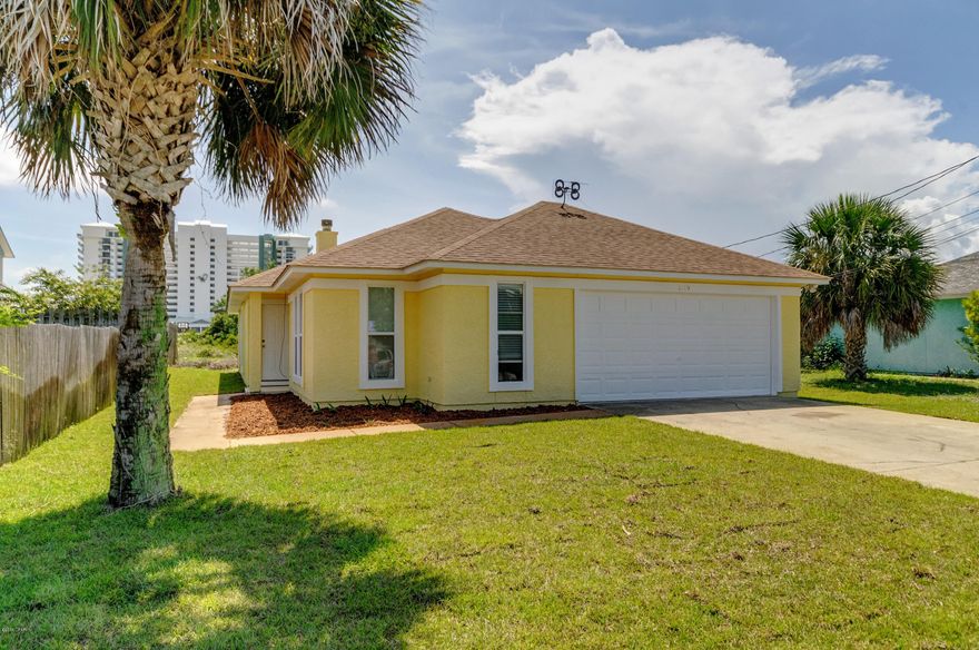 Such a fabulous deal on a great home! LOCATION, LOCATION, LOCATION- 3 blocks to the Gulf's sugar beaches and 2 blocks to Dolphin Boat Launch. Enjoy the relaxed FL casual lifestyle in a private home perfect for retirement, 2nd home or rental investment! Newly upgraded w/ new stucco elastomeric paint, new bath vanities, new tile. LR has vaulted ceiling and wood burning fireplace, sliding doors to outside patio. Great kitchen with stainless appliances, wood cabinets, breakfast bar. New front yard sod, roof is a few years old, ac/just 5yrs old; 2 car garage, NO HOA fees- home is clean and ready for YOU! Septic. So close to beach and lagoon, dining, entertainment, shopping, watersports and just 2  miles to St.Andrews St. Park. Flood Zone X. EASY SHOW! Buyer to verify dimensions. Sold AS IS.