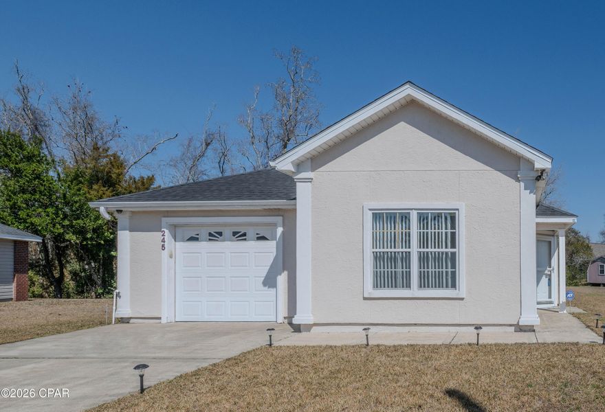 First time buyer? Downsizer?  Investor looking for a short term rental/hybrid furnished rental for renting by the month with close proximity to Tyndall AFB?  This home checks all the boxes for those categories!  With a brand new roof installed this week, HVAC installed 2 weeks ago, (10 year warranty), high end water heater installed March of 2024, the home is ready to go for your finishing decorative touches.  The house has high ceilings with plant ledges, a gorgeous palm leaf ceiling fan in the living room and a split floor plan.  The tiled shower in the ensuite bath in the master suite gives a higher end feel.  Walk in closet provides plenty of storage for fashionistas!  Pour a cup of coffee and enjoy the roomy screened in porch to watch birds in the solitude of your back yard that backs up to woods.  The house is at the back of a semicircle making for quiet, low traffic location.  The neighborhood is great and there are sidewalks to enjoy safely walking and biking.  Home is close to shopping, restaurants, and medical facilities.  Estate sale is scheduled, so let your agent know if you are interested in items.  Possessions are also negotiable if you want to buy the home fully furnished.