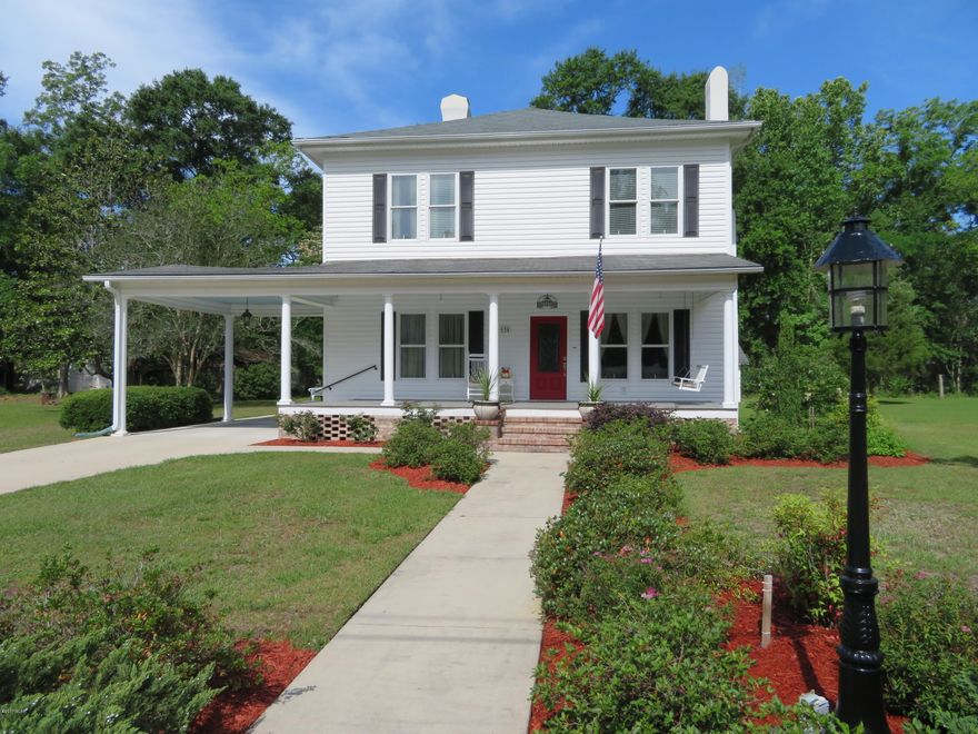 Old world meets new in this stunning historical home that has been perfectly renovated to preserve its charm and history but more like a beautiful brand new home!  You won't find a better floor plan with the chef's dream kitchen, spacious living/family rooms and the master br downstairs.  Upstairs you'll discover the other 4 lovely bedrooms and bathroom.  The detail is absolutely amazing with beautiful hardwood floors throughout the majority of the home, high ceilings, 6 original fireplaces (beautiful but non-functioning).  The kitchen is to die for!  You can entertain with pride with it's attractive granite counters and new cabinets, gas stovetop, double ovens, wine cooler and more .  The dining room is spacious and showcases the glamorous kitchen with it's double French doors. The master bedroom is spacious with built in bookcases, a private bathroom with double vanities and a walk in closet that also opens to the laundry room making laundry chores easier.  The full guest bathroom downstairs is one of the most charming features of the home with its vintage claw foot tub, pedestal sink, chandelier, and black and white mini tiles. The home is extremely well insulated and has all new windows which shows on the low power bills.   All of this and you have a 20x24 detached garage plus an 18x20 detached workshop with 240 volt power and work benches.  The yard is well manicured.  The roof was replaced in 2014 both on the home as well as the 2 detached garages.  The siding is Norandex Polar Wall siding offering R2.5 energy efficiency rating.  The home has a Rinnai tankless hot water heater, updated electrical, and updated plumbing all the way to the street.  This is a must see because the pictures don't do it justice.  There is nothing to do but buy it and move in!