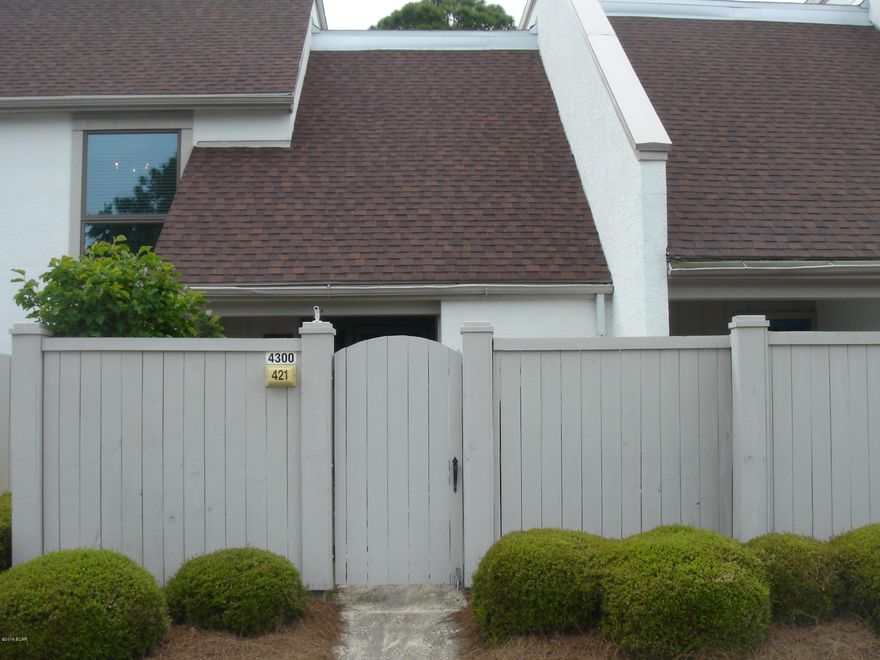 Lovely garden entrance. 21x13 living room has vaulted ceiling and wood burning fireplace.Enclosed 13x10 Florida Room over looking the meadows golf course. Split bedrooms. Guest bedroom has 12x5 Balcony.  Freshly painted and New carpet. There is also a Bay Point HOA fee annually of $1325.00.  Age, SF and room sizes are approximate. Please verify if important.
