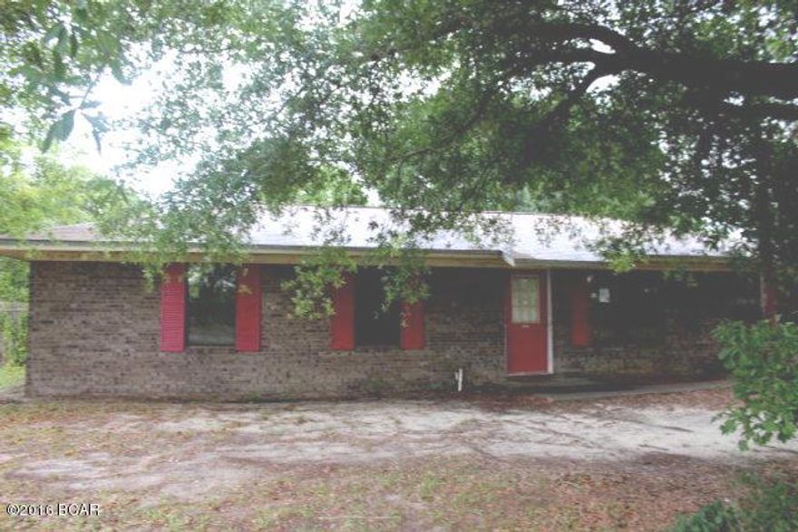 REDUCED PRICE!! This brick home is in the country with 12.44 acres included. The home has 3 bedrooms, a large kitchen with breakfast nook and a formal dining room. There is an office and a large back porch. There are nice shade trees around the house. You have easy access to Tallahassee from this location.