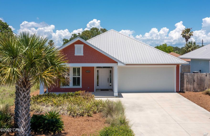 UNDER CONTRACT, TAKING BACKUPS- This 2015 beautifully built craftsman style home is located in the highly desired area of south lagoon on PCB's East End. Short term rental are popular in this area of the beach. As you enter this split floor plan home, find 9' ceilings with crown molding, hand scraped wood floors and 3' wide doors. Plantation shutters allow for abundant natural light to pour into the living space and kitchen. In the kitchen, you will find granite countertops, Frigidaire stainless steel appliances and a covered porch accessible from the breakfast area. A double car garage is attached to stow your beach toys, car or golf cart. Hurricane panels and a metal roof offer for great protection during storm season. Just around the corner is the Dolphin boat ramp. This convenient access allows you to drop in your boat or ski to enjoy a fun day out on the water would make for a great forever home or investment property since it allows for SHORT TERM RENTALS. The home next door is also for sale at 7100 Sunset Ave. Buyer to verify all measurements if important. Home is located in Flood Zone X. Tenant in place until end of June 2022. Rick Seltzer Park and Finn's Island Style Grub are just around the block for your convenience.