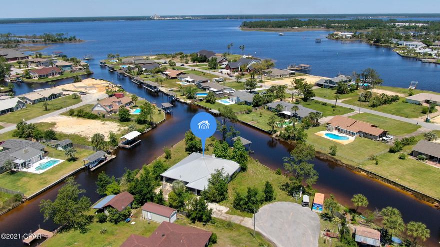 'CURRENTLY UNDER CONTRACT, SELLER ACCEPTING BACKUP OFFERS'. Here is a rare opportunity to own a gorgeous waterfront lot at the peak of the canal. This could be a great fix and flip, fix and hold, or tear down and build your waterfront dream home. So many options on this large lot in the sought after area of Lynn Haven. There is a boat dock already on site that may be salvageable. This property is located at the end of the street on a cul de sac. All sizes, measurements, info are approximate; please verify if important.