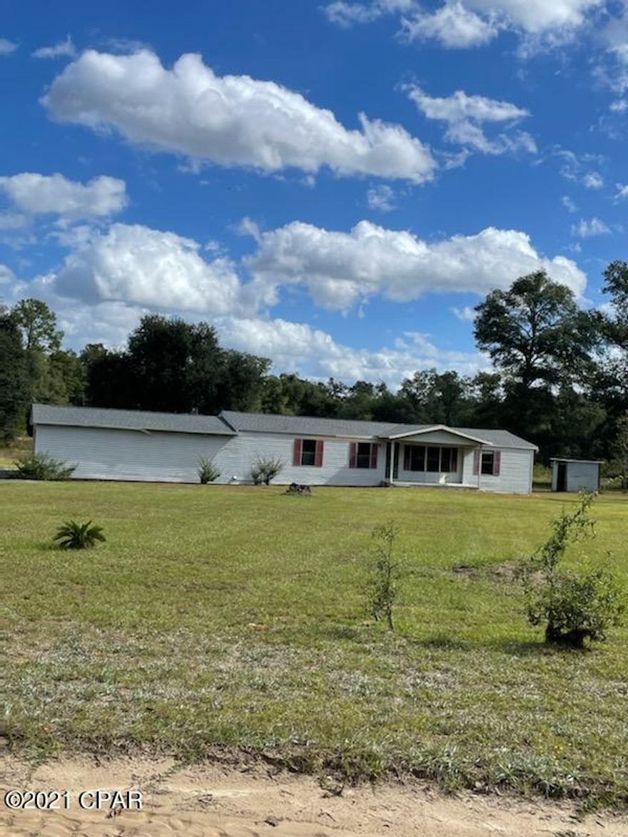 Are you looking for a home for your family?? Well here it is. Nice 3 bedroom 2 bath DWMH with 1344 sq ft in Greenwood off Whispering Pines Circle. The home sits on 5.37 acres and has an attached 2 car garage. New roof on Home and garage. Split bedroom plan. Home needs some work but can be made into the perfect home for your family! This home will NOT lat long at this price so call today for your personal showing!!