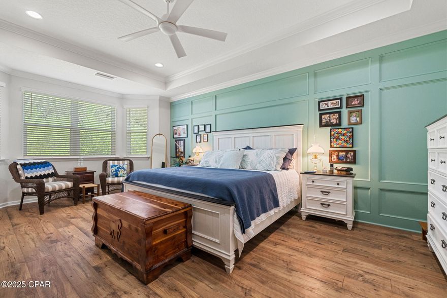 Discover Elevated Coastal Living in Latitude Margaritaville Watersound! 

Elevate your vision of paradise in this stunning Cabana, Beach Collection, single-family floorplan, a 2,394-square-foot retreat that's been thoughtfully transformed with premium builder upgrades and exclusive post-closing luxury enhancements. These custom touches create a one-of-a-kind sanctuary that stands out among its neighbors, blending timeless Margaritaville charm with sophisticated, personalized flair.

Nestled on a coveted premium preserve lot in Fabulous Phase Five, this home invites you into a world of natural serenity and modern convenience. 

A sleek paver-stone driveway guides you to the 2-car garage (408 square feet), outfitted with a whole-house water filtration system, built-in storage shelving, durable polyurea flooring, and convenient pull-down attic stairs for effortless organization.

Step inside to the heart of the home: a breathtaking Great Room where vaulted ceiling beams and a striking tongue-and-groove accent wall draw the eye upward, complemented by bespoke wall colors and a cozy gas fireplace. It's the perfect gathering space for sunset toasts and lively conversations, all under a canopy of coastal elegance.

The gourmet kitchen is a chef's dream, featuring lustrous quartz countertops, a designer tile backsplash, 42-inch cabinetry with elegant crown molding, and soft-glow under-cabinet lighting framed by a valence. At its center, a spacious island shines with a custom tongue-and-groove kick wall that echoes the Great Room's accents, turning meal prep into a seamless, stylish affair.

Retreat to the lavish master bedroom suite, where a trimmed tray ceiling and bay-windowed sitting area flood the space with light and tranquility. Custom wall colors and an exquisite wainscoting accent wall add layers of warmth and sophistication, making it your private oasis.

The adjoining master bathroom exudes spa-like serenity with its tongue-and-groove accent wall, designer light fixtures, and bespoke vanity mirrors—every detail crafted for effortless indulgence.

Storage is elevated throughout, with custom organizational systems in the closets, pantry, garage, and laundry room, maximizing every inch for clutter-free living.

And that's just the beginning—countless additional interior upgrades await discovery, best experienced in person to truly appreciate their artistry and impact.

Unwind outdoors on the extended, screened lanai (complete with bird-caging for pest-free bliss), paved in elegant stones and framed by the lush, wildlife-rich preserve. It's your front-row seat to nature's symphony, ideal for morning coffee or evening stargazing.

Prime Location, Endless Adventures: Glide just 5 minutes by golf cart to the exciting new Watersound West Bay shopping center. Embrace the Gulf's powdery white sands in under 10 miles—via car or the community's shuttle service. Touch down at Northwest Florida Beaches International Airport in less than 15 minutes, and access Tallahassee Memorial Healthcare's state-of-the-art Primary Care campus with ease.

Seize Your Slice of Margaritaville Magic: Why wait for new construction delays and inferior lots when this turnkey gem lets you dive into the laid-back lifestyle right now? Revel in the community's world-class amenities—from pools and fitness centers to live music and beach vibes—while basking in Florida's golden sunshine and peaceful preserve views. With its unparalleled upgrades, this home isn't just a property; it's your personalized portal to joy. Schedule your private tour today and make the dream yours—before it's gone!