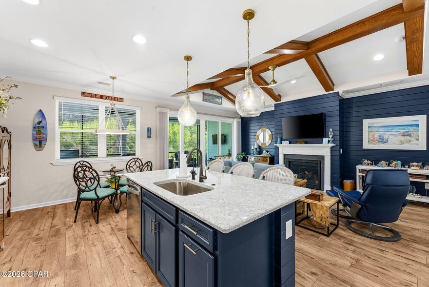 Motivated Sellers Alert: Turnkey Luxury Cabana on Premium Preserve Lot in Latitude Margaritaville Watersound!

Why settle for new construction waits, inferior lots, or endless upgrades when this stunning Cabana (Beach Collection single-family floor plan) delivers it all--2,394 sq ft of elevated coastal elegance, ready for immediate move-in?

Nestled on a coveted premium preserve lot in fabulous Phase Five, this home backs to lush, wildlife-rich green space for ultimate serenity and privacy. A sleek paver driveway leads to the 408 sq ft 2-car garage, equipped with whole-house water filtration, built-in shelving, durable polyurea flooring, and pull-down attic stairs for smart storage.

Inside, the open Great Room captivates with vaulted beamed ceilings, a striking tongue-and-groove accent wall, custom paint, and a cozy gas fireplace--ideal for gatherings and sunset toasts. The gourmet kitchen impresses with quartz countertops, designer tile backsplash, 42'' crown-molded cabinetry, under-cabinet lighting with valance, and a custom island kick wall that ties everything together seamlessly.

The lavish primary suite is your personal retreat: tray ceiling, bay-windowed sitting area with abundant light, custom wainscoting accent wall, and spa-like bath featuring tongue-and-groove details, designer fixtures, and bespoke vanity mirrors. Thoughtful custom organization shines throughout--closets, pantry, laundry, and garage--for effortless, clutter-free living.

Step outside to the extended screened lanai (with bird-caging for bug-free enjoyment), paved in elegant stone and overlooking the peaceful preserve--your perfect spot for coffee, stargazing, or al fresco dining amid nature's soundtrack.

Bonus: A 2023 Evolution HDK Ranger golf cart conveys with acceptable offer terms!

Location perks make life easy: Just 5 minutes by golf cart to the new Watersound West Bay shopping/dining hub, under 10 miles to pristine Gulf beaches (via car or community shuttle), ~15 minutes to Northwest Florida Beaches International Airport, and quick access to top-tier healthcare.

This isn't just a home--it's a personalized escape into the vibrant, Jimmy Buffett-inspired 55+ lifestyle: multiple pools, Fins Up Fitness, on-site dining, live entertainment, pickleball, and endless island vibes.

Motivated sellers are ready to make this dream yours--don't miss the chance to skip the build process and start living the Latitude life today. Schedule your private showing now; opportunities like this preserved-lot gem with premium upgrades move fast!