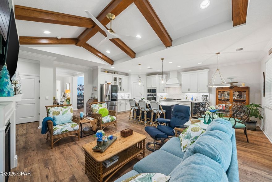 Discover Elevated Coastal Living in Latitude Margaritaville Watersound! 

Elevate your vision of paradise in this stunning Cabana, Beach Collection, single-family floorplan, a 2,394-square-foot retreat that's been thoughtfully transformed with premium builder upgrades and exclusive post-closing luxury enhancements. These custom touches create a one-of-a-kind sanctuary that stands out among its neighbors, blending timeless Margaritaville charm with sophisticated, personalized flair.

Nestled on a coveted premium preserve lot in Fabulous Phase Five, this home invites you into a world of natural serenity and modern convenience. 

A sleek paver-stone driveway guides you to the 2-car garage (408 square feet), outfitted with a whole-house water filtration system, built-in storage shelving, durable polyurea flooring, and convenient pull-down attic stairs for effortless organization.

Step inside to the heart of the home: a breathtaking Great Room where vaulted ceiling beams and a striking tongue-and-groove accent wall draw the eye upward, complemented by bespoke wall colors and a cozy gas fireplace. It's the perfect gathering space for sunset toasts and lively conversations, all under a canopy of coastal elegance.

The gourmet kitchen is a chef's dream, featuring lustrous quartz countertops, a designer tile backsplash, 42-inch cabinetry with elegant crown molding, and soft-glow under-cabinet lighting framed by a valence. At its center, a spacious island shines with a custom tongue-and-groove kick wall that echoes the Great Room's accents, turning meal prep into a seamless, stylish affair.

Retreat to the lavish master bedroom suite, where a trimmed tray ceiling and bay-windowed sitting area flood the space with light and tranquility. Custom wall colors and an exquisite wainscoting accent wall add layers of warmth and sophistication, making it your private oasis.

The adjoining master bathroom exudes spa-like serenity with its tongue-and-groove accent wall, designer light fixtures, and bespoke vanity mirrors—every detail crafted for effortless indulgence.

Storage is elevated throughout, with custom organizational systems in the closets, pantry, garage, and laundry room, maximizing every inch for clutter-free living.

And that's just the beginning—countless additional interior upgrades await discovery, best experienced in person to truly appreciate their artistry and impact.

Unwind outdoors on the extended, screened lanai (complete with bird-caging for pest-free bliss), paved in elegant stones and framed by the lush, wildlife-rich preserve. It's your front-row seat to nature's symphony, ideal for morning coffee or evening stargazing.

Prime Location, Endless Adventures: Glide just 5 minutes by golf cart to the exciting new Watersound West Bay shopping center. Embrace the Gulf's powdery white sands in under 10 miles—via car or the community's shuttle service. Touch down at Northwest Florida Beaches International Airport in less than 15 minutes, and access Tallahassee Memorial Healthcare's state-of-the-art Primary Care campus with ease.

Seize Your Slice of Margaritaville Magic: Why wait for new construction delays and inferior lots when this turnkey gem lets you dive into the laid-back lifestyle right now? Revel in the community's world-class amenities—from pools and fitness centers to live music and beach vibes—while basking in Florida's golden sunshine and peaceful preserve views. With its unparalleled upgrades, this home isn't just a property; it's your personalized portal to joy. Schedule your private tour today and make the dream yours—before it's gone!