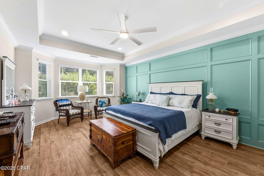 Discover Elevated Coastal Living in Latitude Margaritaville Watersound! 

Elevate your vision of paradise in this stunning Cabana, Beach Collection, single-family floorplan, a 2,394-square-foot retreat that's been thoughtfully transformed with premium builder upgrades and exclusive post-closing luxury enhancements. These custom touches create a one-of-a-kind sanctuary that stands out among its neighbors, blending timeless Margaritaville charm with sophisticated, personalized flair.

Nestled on a coveted premium preserve lot in Fabulous Phase Five, this home invites you into a world of natural serenity and modern convenience. 

A sleek paver-stone driveway guides you to the 2-car garage (408 square feet), outfitted with a whole-house water filtration system, built-in storage shelving, durable polyurea flooring, and convenient pull-down attic stairs for effortless organization.

Step inside to the heart of the home: a breathtaking Great Room where vaulted ceiling beams and a striking tongue-and-groove accent wall draw the eye upward, complemented by bespoke wall colors and a cozy gas fireplace. It's the perfect gathering space for sunset toasts and lively conversations, all under a canopy of coastal elegance.

The gourmet kitchen is a chef's dream, featuring lustrous quartz countertops, a designer tile backsplash, 42-inch cabinetry with elegant crown molding, and soft-glow under-cabinet lighting framed by a valence. At its center, a spacious island shines with a custom tongue-and-groove kick wall that echoes the Great Room's accents, turning meal prep into a seamless, stylish affair.

Retreat to the lavish master bedroom suite, where a trimmed tray ceiling and bay-windowed sitting area flood the space with light and tranquility. Custom wall colors and an exquisite wainscoting accent wall add layers of warmth and sophistication, making it your private oasis.

The adjoining master bathroom exudes spa-like serenity with its tongue-and-groove accent wall, designer light fixtures, and bespoke vanity mirrors—every detail crafted for effortless indulgence.

Storage is elevated throughout, with custom organizational systems in the closets, pantry, garage, and laundry room, maximizing every inch for clutter-free living.

And that's just the beginning—countless additional interior upgrades await discovery, best experienced in person to truly appreciate their artistry and impact.

Unwind outdoors on the extended, screened lanai (complete with bird-caging for pest-free bliss), paved in elegant stones and framed by the lush, wildlife-rich preserve. It's your front-row seat to nature's symphony, ideal for morning coffee or evening stargazing.

Prime Location, Endless Adventures: Glide just 5 minutes by golf cart to the exciting new Watersound West Bay shopping center. Embrace the Gulf's powdery white sands in under 10 miles—via car or the community's shuttle service. Touch down at Northwest Florida Beaches International Airport in less than 15 minutes, and access Tallahassee Memorial Healthcare's state-of-the-art Primary Care campus with ease.

Seize Your Slice of Margaritaville Magic: Why wait for new construction delays and inferior lots when this turnkey gem lets you dive into the laid-back lifestyle right now? Revel in the community's world-class amenities—from pools and fitness centers to live music and beach vibes—while basking in Florida's golden sunshine and peaceful preserve views. With its unparalleled upgrades, this home isn't just a property; it's your personalized portal to joy. Schedule your private tour today and make the dream yours—before it's gone!