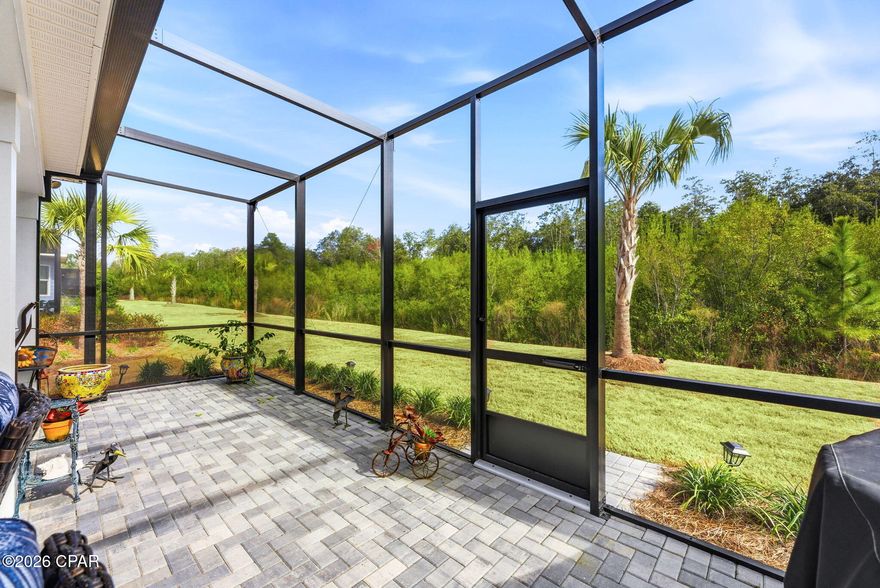 Motivated Sellers Alert: Turnkey Luxury Cabana on Premium Preserve Lot in Latitude Margaritaville Watersound!

Why settle for new construction waits, inferior lots, or endless upgrades when this stunning Cabana (Beach Collection single-family floor plan) delivers it all--2,394 sq ft of elevated coastal elegance, ready for immediate move-in?

Nestled on a coveted premium preserve lot in fabulous Phase Five, this home backs to lush, wildlife-rich green space for ultimate serenity and privacy. A sleek paver driveway leads to the 408 sq ft 2-car garage, equipped with whole-house water filtration, built-in shelving, durable polyurea flooring, and pull-down attic stairs for smart storage.

Inside, the open Great Room captivates with vaulted beamed ceilings, a striking tongue-and-groove accent wall, custom paint, and a cozy gas fireplace--ideal for gatherings and sunset toasts. The gourmet kitchen impresses with quartz countertops, designer tile backsplash, 42'' crown-molded cabinetry, under-cabinet lighting with valance, and a custom island kick wall that ties everything together seamlessly.

The lavish primary suite is your personal retreat: tray ceiling, bay-windowed sitting area with abundant light, custom wainscoting accent wall, and spa-like bath featuring tongue-and-groove details, designer fixtures, and bespoke vanity mirrors. Thoughtful custom organization shines throughout--closets, pantry, laundry, and garage--for effortless, clutter-free living.

Step outside to the extended screened lanai (with bird-caging for bug-free enjoyment), paved in elegant stone and overlooking the peaceful preserve--your perfect spot for coffee, stargazing, or al fresco dining amid nature's soundtrack.

Bonus: A 2023 Evolution HDK Ranger golf cart conveys with acceptable offer terms!

Location perks make life easy: Just 5 minutes by golf cart to the new Watersound West Bay shopping/dining hub, under 10 miles to pristine Gulf beaches (via car or community shuttle), ~15 minutes to Northwest Florida Beaches International Airport, and quick access to top-tier healthcare.

This isn't just a home--it's a personalized escape into the vibrant, Jimmy Buffett-inspired 55+ lifestyle: multiple pools, Fins Up Fitness, on-site dining, live entertainment, pickleball, and endless island vibes.

Motivated sellers are ready to make this dream yours--don't miss the chance to skip the build process and start living the Latitude life today. Schedule your private showing now; opportunities like this preserved-lot gem with premium upgrades move fast!