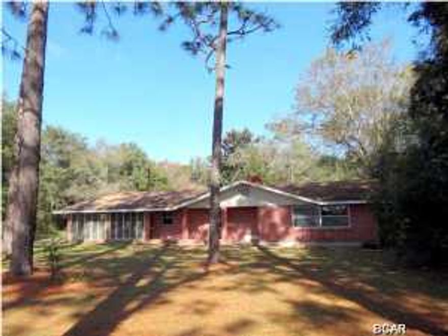 If you like the feeling of living in the country and can imagine having room to roam but still within 10-15 minutes of all the restaurants and businesses that Panama City has to offer, then this Charming all Brick home is what you have been waiting for. The location is a short commute to Tyndall Air Force Base as well. This Spacious all brick home located on 7.76 acres, consists of Two bedrooms, plus an office that can be easily converted into third bedroom. There is a large four-piece bathroom that with upgrades has a lot of potential to truly be a fabulous Master Bath . If you were looking for quality in this price range than you have found it, as the Kitchen in this charming home has solid wood cabinetry, including built in benches that double as extra storage to store your