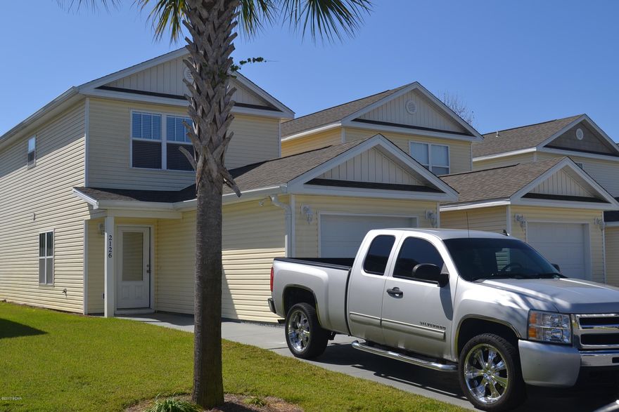 2 BR 1 1/2 bath attached single family home located in the very popular gated community of Sterling Cove. Conveniently located near the Navy Base, schools, shopping and the new Thomas Dr. flyover making access to Panama City a breeze. Spacious kitchen with wood cabinetry, tile floors thoughout the main living area. Master bedroom has French doors leading to it's private balcony. Don't let this once in a lifetime pass you by.!. ALL DIMENSIONS AND SQUARE FOOTAGE ARE ESTIMATED...PLEASE VERIFY IF IMPORTANT!.