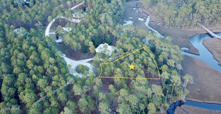Beautiful .64 acre Lot, on a cul-de-sac with amazing, unobstructed views of Crooked Creek and the salt marsh and it is priced to sell at $185,000! Steps away from the community trail system consisting of 7 miles of trails that are connected by boardwalks and overlooks on West Bay and Crooked Creek. RiverCamps is a 1500-acre gated, waterfront oasis geared towards boaters and the outdoor enthusiast. Located directly on the shores of West Bay and Crooked Creek there are less than 450 homesites on 500 acres surrounded by an additional 1000 acres dedicated to conservation. Owners enjoy a community boat ramp with direct access to West Bay and a 30-minute boat ride to the Gulf and Shell Island. Onsite dry boat storage, boat wash stations, docks and day use boat slips. A newly constructed zero-entry pool and pavilion with gas grills. A 600-foot pier on West Bay. New fitness center to be completed late 2026. RiverCamps is just 10 miles from the white sandy beaches of Panama City Beach and Pier Park. 10 minutes from the Northwest Florida Beaches International Airport and 2 miles from the newly announced Publix Grocery store and 450,000 sq ft of future retail space. 
RiverCamps is Panama City Beach's best kept secret. Conveniently located close to everything but far from the crowds and the traffic.