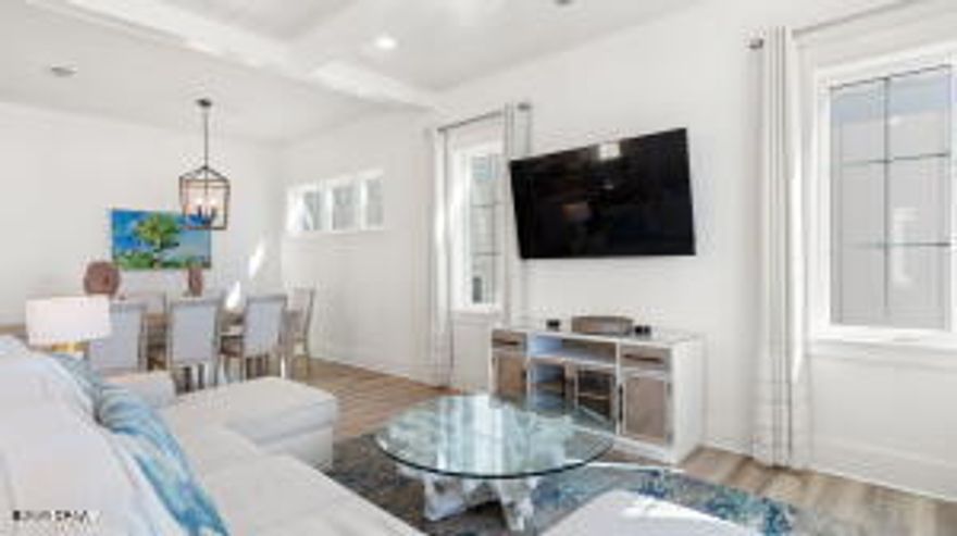 HIGHLY MOTIVATED SELLER!! PRICED 100'S OF THOUSANDS BELOW MARKET VALUE!!! This unbelievable price on this beachfront dream home, fully professionally decorated and being SOLD FULLY FURNISHED, is ready for your family right now. The home is the very best Panama City Beach has to offer not just because of its stunning beach sunsets that can be enjoyed over three expansive gulf front balconies, this home is located in the luxurious Margaritaville Cottages Resort.Tropical pools with bar service, water slides and lazy river for the kids, and nothing short of white glove service. This home features its own gulf front private pool and beach walkover. Modern day amenities of this home allow for multiple generations to enjoy the beachlife, featuring a private elevator going all the way up to the third floor. Just off the pool on the first level is a great room complete with a wet bar, ice machine, full size refrigerator and a large sitting area with lots of seating, big screen tv and a foosball table. Located on this level is also a full size bathroom and bedroom. For the most stunning views of the beach this home features its living and entertaining space on the second floor. Opening up to an expansive balcony is an open concept that allows everyone to enjoy, whether you're relaxing in the deep sectional sofa, having a bite at the dining table or showing off your chef skills in the kitchen for the week featuring fresh gulf seafood, you will be sure to have a stunning view of the emerald coast's sparkling water and white sandy beach. For the chef in the family, this kitchen is sure to not disappoint, featuring Frigidaire Professional Appliances, 36'' gas range, quartz countertops, and exquisite cabinetry. In addition to the living and entertaining space on the second level, the home also features two guest bedrooms with ensuite baths and a full size washer and dryer along with a half bath. Next on the third floor is the beachfront master suite with sweeping gulf views running east to west. Stepping out on the expansive third floor balcony allows its guest to see all the way down the panhandle's coast line. Getting ready for your day or unwinding is nothing short of luxury in the exquisite master bath, featuring a massive oversized glassed-in shower with stunning tiles and a walk-in closet. The 3rd floor also includes two additional guest bedrooms with ensuite baths, as well as another bunk area. Plenty of parking with a two-car carport, as well as three additional spaces. Owners and guests will experience the ultimate in island-inspired dining and drink options with Margaritaville's signature concepts, including The Salty Rim Bar & Grill Fins Restaurant and Bar, and Joe Merchant's Coffee & Provisions.Unwind in the expansive resort oasis pool, complete with private cabanas, H20 Adventure Waterslides, and a 425-foot lazy river. Engage in a friendly game of pickleball, participate in activities on the lawn, or test your skills in the indoor arcade. At Margaritaville, they cater to every preference. If relaxation is your goal, soak up the sun on the beach. If adventure is your calling, try the bike rentals or paddleboard lessons. With options to suit every itinerary, Margaritaville promises an unforgettable beach experience. Call today for additional information on the resort, rental income potential and to see this beautiful beachfront home.