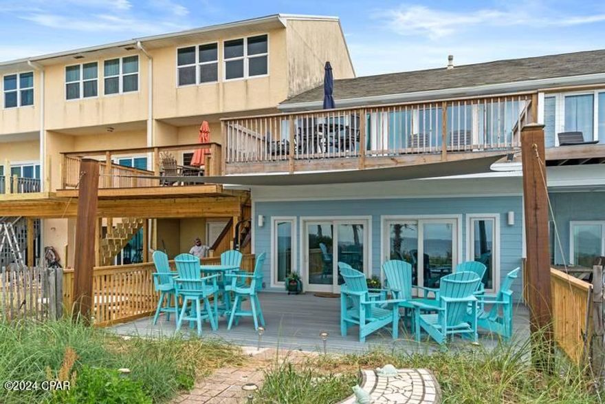 Beautiful 3BR/2.5BA beachfront townhouse that has been totally renovated and is turnkey rental ready.  NO HOA fees.  This townhouse offers 25 feet on the water and a garage for extra storage.  Amazing sunset views from the huge oversized back deck that is 23x20 feet The master bedroom is beachfront with access to the upstairs deck.  Updated kitchen has quartz countertops, Island with breakfast bar, stainless steel appliances, gas stove and wine cooler.  New roof 2023, all wood looking tile throughout, exterior was upgraded to hardy Board in 2021. Many upgrades and a great investment property.  Call to see today.