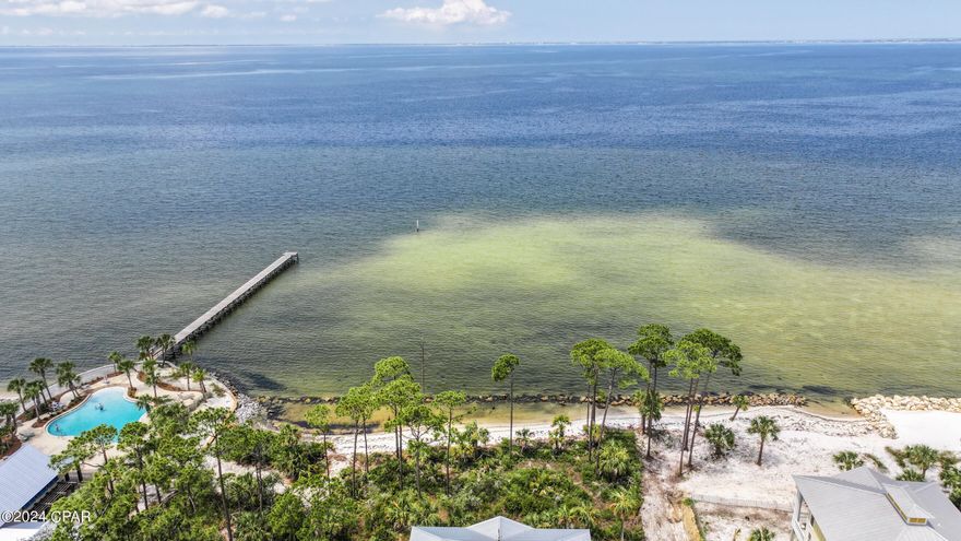 This exceptional bayfront property, positioned just steps away from the pristine shoreline in WindMark Beach, offers an unparalleled location. Encompassing nearly a third of an acre, this expansive lot provides the flexibility to build your dream home at your own pace, with no constraints on timing. Nestled in a serene environment, this locale radiates the atmosphere of a secluded sanctuary, with its pet-friendly white sand beach and close proximity to St. Joseph Bay just a short stroll away. Residents can indulge in a variety of community amenities, including a bayfront pool, boat docks, and picturesque nature trails. Whether casting a line from the communal dock or exploring the area via golf cart, residents can fully embrace the laid-back lifestyle of this golf cart-friendly community, which also boasts upscale dining options, boutique shops, and a fitness center. With its attractive price and promising investment potential, this bayfront lot offers a compelling opportunity for buyers. Don't let this chance slip by to create a cherished legacy for your family on this remarkable property!