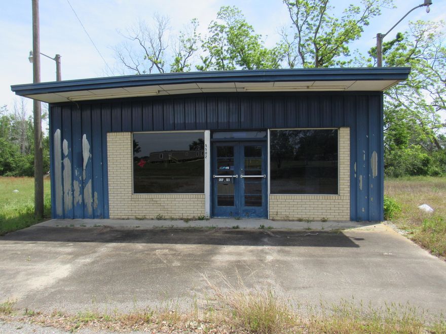 HUGE INVESTMENT OPPORTUNITY! Large corner lot with metal building that could be used as a warehouse or many other businesses! Building has a roll up door also! There is a pole barn with shed attached in the back! Property also has an above ground concrete platform for loading! Unlimited potential! Don't miss out on this opportunity! Cash or owner finance only. Seller willing to make a trade for property in Panama City. Please verify all information and measurements.
