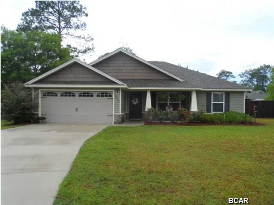 CHARMING CRAFTSMAN COTTAGE on a quiet Cul-de-Sac conveniently located close to the Mall, Bay Haven Charter Schools and Tyndall AFB. This IMMACULATE 2009 Built home includes 3 bedrooms and a dedicated office space in a functional split floor plan. The cozy front porch sets the stage and once inside you'll love the OPEN FLOOR PLAN. Dark Hard Wood flooring and cathedral ceilings make the most of the square footage and allow space all your furniture. The Kitchen features 42 inch Wood Cabinetry, nice appliance and a Breakfast Bar that connects with the Dining area. French Doors lead out to a spacious SCREENED PORCH perfect for casual dining and enjoying the huge privacy fenced back yard. The Master Bedroom and Bath are privately tucked into their own corner and include a Walk In Closet.