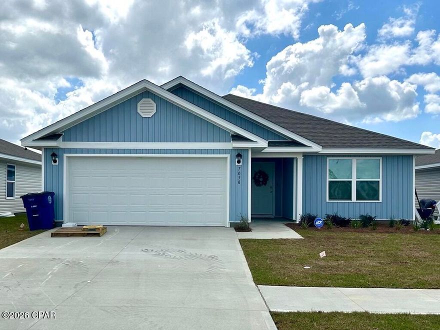 Welcome to the Lismore, a new home floor plan located at Liberty in Panama City, Florida. The Lismore is thoughtfully designed 3-bedroom, 2 bathroom, one-story home with 1.580 square feet of modern living. On the outside of your home, you will see durable vinyl siding, a spacious two-car garage with an opener and a fully sodded yard to the property lines. This home comes equipped with dimensional shingles with a limited lifetime warranty, electronic deadbolts on all exterior doors, weatherproof outlets, and hose bibs. Sidewalks line the neighborhood streets for you to enjoy the beautiful Florida weather at Liberty. Inside you will see 8' ceilings throughout, engineered vinyl plank flooring throughout the home and carpet in the bedrooms. The front bedrooms, bathroom, and garage are close to the front door and welcome you into an open living room and kitchen, perfect for having guests over. Granite countertops, white cabinetry with soft-close are in the kitchen and bathrooms, and the kitchen island make hosting or serving dinner at the bar a breeze. Complete with a pantry, and stainless-steel appliances including smooth top range, microwave, and dishwasher means your kitchen is fully equipped. The living room has plenty of windows for natural lighting and leads right to the back door. Each bedroom comes with soft carpet floors and spacious closets. The Primary Bedroom features a bathroom with a detached shower and double vanity with granite countertops. The walk-in closet is adjacent to the bathroom, meaning more space in your bedroom. As with all the homes in Liberty, your home is outfitted with the latest Smart Home technology allowing you to manage your home right from your phone, making your comfort easy and exceptional. Our Liberty community features underground utilities making it less susceptible to damage from severe weather leading to fewer outages and more reliable service. Residents of Liberty can enjoy exclusive access to two amenity centers, complete with two pools, a children's splash pad, two playgrounds for endless fun, a well-equipped gym, poker room, yoga room, two pickle ball courts, basketball court, and a well-equipped fitness center. Embrace the lifestyle you deserve where every detail is curated for your ultimate enjoyment.