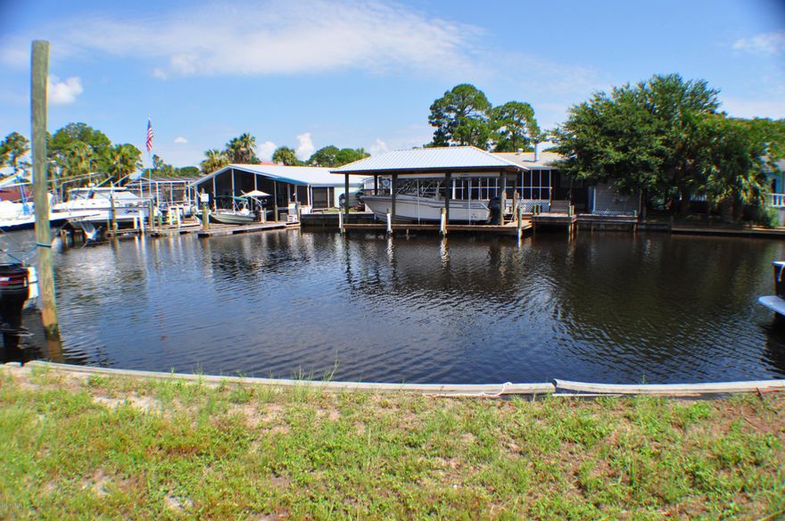 CURRENTLY UNDER CONTRACT.  SELLER IS TAKING BACKUP OFFERS. Gorgeous waterfront lot in Harbour Cove Village! This is a 45x84 lot on a canal with bay and gulf access and an excellent spot to build your dream home! The lot has been cleared. Harbour Cove Village is a gated community close to the Navy base, shopping, beaches, and more. All info is approximate and should be verified by Buyer(s) if important. Seller is a Licensed Florida REALTOR.