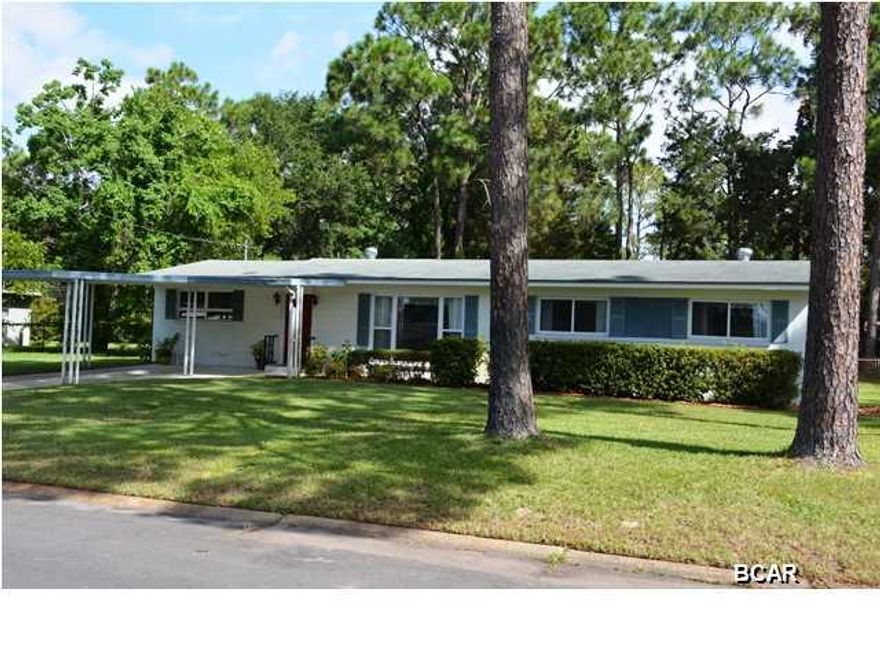 Excellent first time home buyer opportunity! This solidly built three bedroom home is an excellent value and is priced to sell. As you enter the home, you are met with a spacious living room leading to large kitchen and dining area. You'll enjoy the cozy family room with fireplace and the view on the backyard. Each of the bedrooms are spacious, while the master bedroom has an adjoining bathroom. The living areas are floored with wood laminate, while the bedrooms have a neutral carpet. An added feature of this home is the converted garage, suitable for a home office or craft/music room. This home is only blocks from everything Panama City has to offer, but yet far enough away to not be effected by road noise and congestion. Priced to sell and move-in ready, so don't miss this