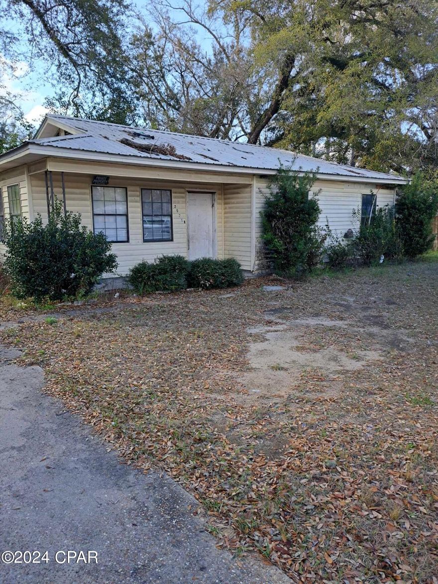 Nestled in the heart of Marianna, FL, at 2925 Harley Dr, this unique fixer-upper holds a world of potential for the right buyer. With city water and sewer services, and situated on a paved road, this property offers the perfect canvas for creating your dream home. The exterior boasts durable vinyl siding paired with a sturdy metal roof, ensuring long-lasting protection against the elements. Although in need of extensive renovations, this home presents an incredible opportunity for investors or DIY enthusiasts looking to put their stamp on a property. Envision transforming this space into a bespoke residence or a profitable investment property. The possibilities are endless with this hidden gem, waiting for someone with vision and passion to unlock its full potential.