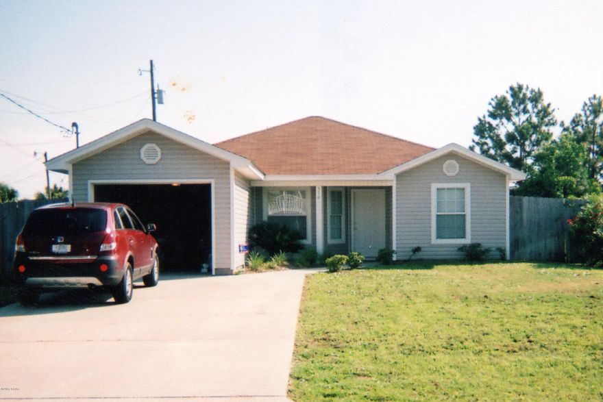 Immaculate home walking distance to the beach and Grand Lagoon including public boat ramp! Three bedroom and two bath home features an open and spacious floor plan. (Furniture is optional.)  Kitchen with eating area, counter, ceramic tile and lots of cabinets. Spacious living room is equipped with a built-in stereo speaker system. Double French doors lead to back yard with privacy fence, covered patio and outdoor shower. Large corner lot has a double gate to enable storing your RV or boat.  All information given is believed accurate, if important to you please confirm. Furniture optional if you want a vacation home all ready to go!