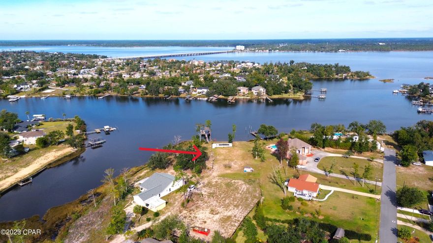Waterfront! 150 feet of Stunning waterfront, deep water access, in coveted Lynn Haven on Anderson Bayou with an open view of dazzling North Bay. Seawall, Boathouse, Pool already on-site, bring your own custom home design. With low inventory, building your own home is a fantastic solution. No HOA, No ARB - bring your contractor and design the home of your own dreams! Also, room for workshop, RV storage. 32444 is one of the best places to live in Bay County and adding waterfront, Gunite pool and 10,000lb boat lift, an incredible opportunity. The boat house will house up to a 30 foot boat. Water, electric on-site, sewar available. Extremely private, no drive by traffic. Sunrises over North Bay and Sunsets over Anderson Bayou are included! BONUS-neighboring owner is running underground utilities to include - natural gas, water, sewer, as well as a paver drive from 8th Street to all home lots (minimal cost to Buyer to tap in).
 Bring your boat and Come visit the best home site available in Lynn Haven today!