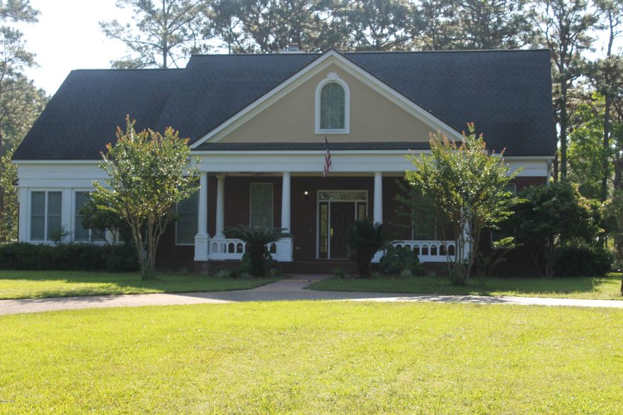 This Stunning, all brick home sits on 1.6 acres of land right in the center of town! From the moment you walk up to house and see the enormous Southern style, brick front porch with solid wood door, this house will amaze you. Once inside you will be impressed at the hard wood flooring throughout the foyer and formal dining area. An open staircase leads you up stairs where you will find two large bedrooms and a jack n Jill bath and interior storage area. This home offers a spacious living area with built in book cases, fire place, custom kitchen with white appliances and Corian counter tops. The kitchen alone is a home owner dream, if you like to entertain, this is the house for you! There is also a Den/Florida room off the Living with area with French doors that lead to the back covered porch and extra-large double garage with rear entry. The Master bedroom is on the first floor and is attached to the spacious office area that is also lined with built in book shelves, the Master bath has his and her walk in closets one measuring 7x9 and one measuring at 6x10 Both come with built in dressers. The laundry room is extra-large with cabinets and sink and a bath is down stairs for guests. This home sits off of the main road just enough to be as peaceful as can be but still be only 3 minutes from Gulf Coast Hospital and 10 minutes from Bay Medical. Home has been Freshly painted inside and out and has had professional landscaping done. Home has a well for irrigation as is on city water and city sewer. The seller is offering a flooring allowance to replace the carpets for the new owner but would like you to pick them out. Please call your Realtor today to see this Magnificent home in Panama City.