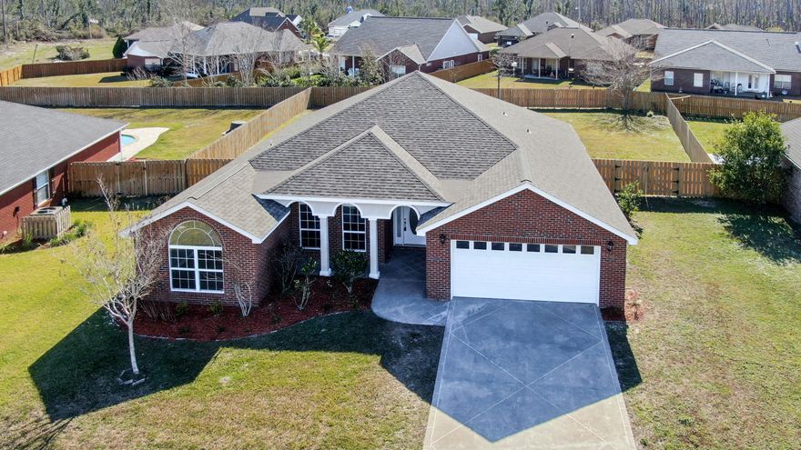 /*/*/*/ CAMRYNS CROSSING BEAUTY/*/*/ */ Huge OPEN floor plan offers Luxury vinyl plank in the foyer, great room,dining area and master bathroom. Tile in the hallway to master bedroom, laundry room, kitchen, bathrooms and carpet in all bedrooms. 4BED/ 2BATH with a SPLIT BEDROOM floor plan. High ceiling in living area and tray ceiling in master bedroom. Beautiful Alabaster color cabinets in kitchen, granite countertops, and stainless steel appliances, electric smooth top stove and large under the counter double sink.  The spacious great room crown molding, an electric fireplace and recessed lighting.  SPACIOUS MASTER SUITE features a tray ceiling, two walk-in his and her closets, double vanity, tub and separate tile shower. New roof and warranty for appliances/HVAC. Additional outdoor living area is a unique added benefit to this home.  The back yard has a NEW LARGE PRIVACY FENCE with a programmable in-ground sprinkler system.  There is a lanai, extended brick porch and custom pergola that is great for entertaining and spending time outdoors.  The large two car garage includes access to a storage attic with pull down stairs.  Centrally located near major medical facilities, shopping venues, schools