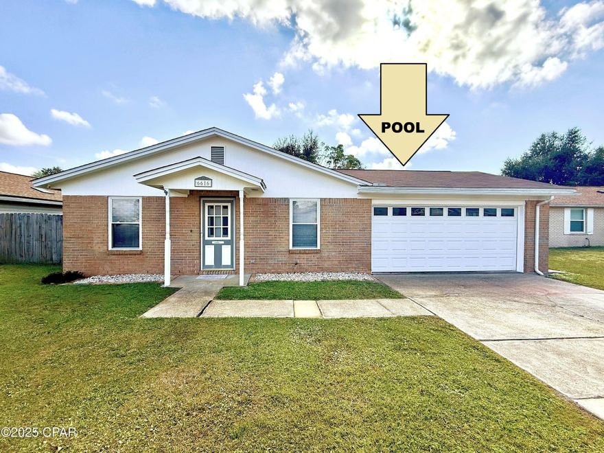 COMFORTABLE HOME WITH INGROUND POOL Near Tyndall Air Force Base! This 3-bedroom, 2-bath home features a practical floor plan with hardwood and tile flooring, white walls for a blank canvas, and an open kitchen/dining layout. The remodeled kitchen offers ample counter and cabinet space, a breakfast nook, and space for cooking and gathering.  The master suite includes access to the covered back porch and has an en-suite bath with a beautifully tiled shower. Two additional bedrooms share a hall bath.  The 2-car garage includes shelving, offering space for vehicles, storage, or projects.  Situated on a 60x112 lot, the exterior features an in-ground pool, a fully fenced backyard, a covered porch, and a small storage shed. Major updates within the past 10 years include windows, HVAC, roof, water heater, and kitchen. Additional features include underground utilities and sidewalks throughout the community. Conveniently located near shopping, dining, schools, parks, and a boat launch, this home offers both comfort and convenience.  Schedule your private showing today!