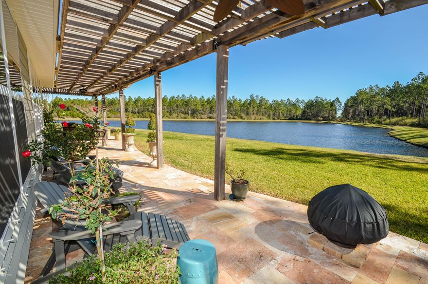 This Incredible David Weekly Coastal Craftsman home is situated on one of the premium lots within in the highly sought after community of Breakfast Point.  From the moment your feet hit the beautiful travertine tile on the front porch, you will fall in love with this home. As you enter through the front door, just beyond the gorgeous foyer, you will discover a wall of windows located in the great room where you will see the picturesque pond located right in your back yard! Just off the open foyer you will find an abundance of entertainment space with a formal dining room and music or formal living space. The large kitchen comes complete with beautiful 36” maple cabinetry which includes 2 pull out tray shelf-gliders and 2 pot and pan drawers, crown molding, upgraded granite countertops, walk in pantry and GE Stainless Steele appliances. The owners of this home will also enjoy an oversized kitchen island and breakfast nook, perfect for morning coffee while enjoying views of the water. The kitchen offers not only offers those great features, but also a built-in computer gallery and desk all with granite countertops which opens to the comfortable great room overlooking the pond. The master bedroom is located off the kitchen and easily accommodates California King Size bedroom furniture. Step inside the luxurious master bath which includes a large garden tub, standalone shower, granite vanity with double sinks and a huge walk-in closet complete with luggage storage and a security safe. This amazing home has a split floor plan with 3 additional bedrooms, 2.5 additional baths and a huge bonus room located upstairs. Throughout the home you will find upgraded hardwood flooring and carpet in the bedrooms, 9' ceilings and 10' in the entry way. Not only is the home equipped with so many great features including a 2 car garage, a sprinkler system, a construction pool package installation, the new home owner will enjoy a BEAUTIFUL custom built Pergola in the back yard! This Pergola was designed and created by Sam Striblin who designs and works mostly from Rosemary Beach. There is approximately 500 square feet with cypress wood, a granite outdoor kitchen with Napoleon Master Gas Grill, travertine tile, 2 industrial outdoor fans and custom accent lighting. This outdoor space is just like your own paradise with the view of the water! Such a great space for entertaining or relaxing! This is a beautiful must see Breakfast point home located close to great schools, shops, Pier Park shopping, doctor's offices and an abundance of  dining options.