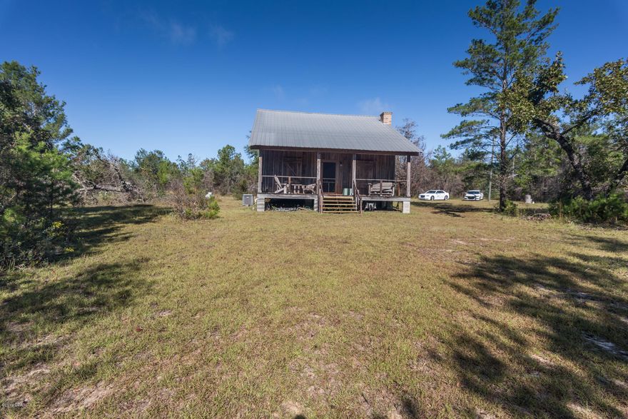 this 40 acres has a cabin, small barn, a man made shooting range, spring fed creek that runs thru part of the 40 acres..you have a front and back porch to sit on and see if you can see some deer or turkeys..the home has one bedroom,one bath,eat in kitchen, granite counter tops, gas stove and large loft upstairs,fireplace in living area....this place could be a hunters delight or a place to come and relax or even better live here...