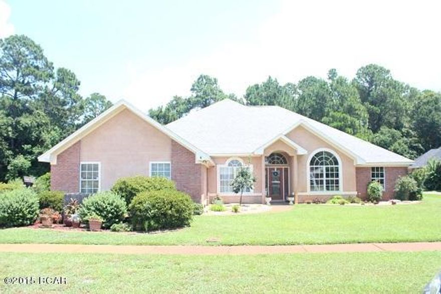 Lovely brick and stucco home centrally located in The Woods.  The Woods is an upscale neighborhood located in the middle of Panama City.  This fine neighborhood is very close to shopping, restaurants and hospital and features a nice entry way and sidewalks.  The home has a great floor plan with lots of living space.  It features hardwood flooring in the foyer, brick fireplace in the living room, open kitchen and family room, 10 ' ceilings throughout, vaulted ceiling in the family room, crown moulding, and lots of double paned windows for natural lighting.  The kitchen offers tons of counter space, oak cabinets, island stove, and breakfast bar.  The kitchen is open to the family room and is perfect for entertaining. One of the additional bedrooms has its own hall bathroom access which is perfect for the in-laws.  The master bedroom features exterior access to the back deck and trayed ceilings while the master bathroom offers double vanity, separate shower, jacuzzi style tub, built-in cabinets and a large walk-in closet. The back patio is under roof and has sliding storm doors.  Enjoy the screened-in in-ground pool protected from the elements.  Have fun again cooking out and swimming without the pesky mosquitos chasing you back into the house!  The home has several updates such as private well for sprinkler system, a/c replaced in 2013, water heater replace in 2012, cook top stove replaced in 2012, roof replaced in 2005, new ceiling fans and lights replace in 2015.  This truly is a very nice home with lots of space and perfect location on the cul-de-sac.  This home does not require flood insurance.