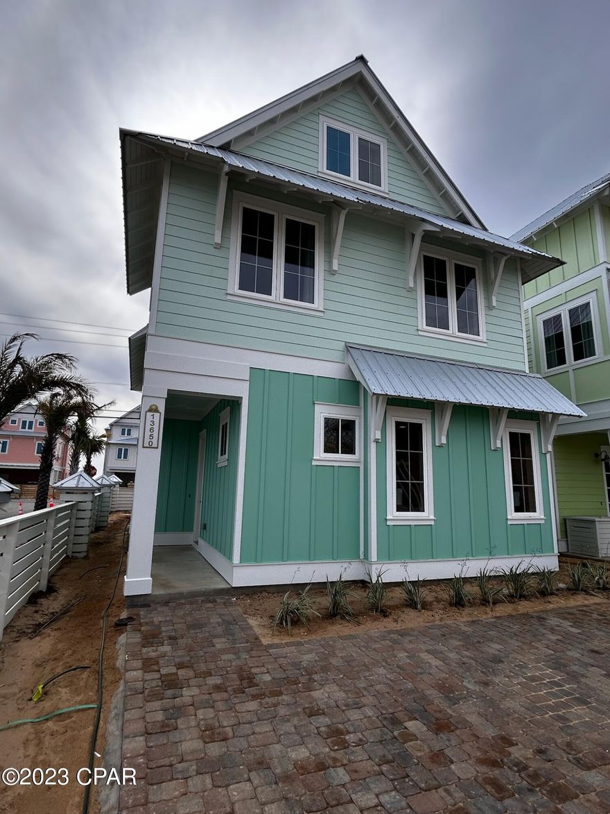 Live the Margaritaville lifestyle and enjoy the amazing views from all 3 levels of this new construction, 5 bedroom plus bunks, 4 ½ bath home. Margaritaville Beach Cottage Resort offers homeowners a chance to live the dream of owning at Margaritaville and the opportunity to share that dream with vacationers eager to book a stay here! You'll have a hard time deciding which way to enjoy the water first! You can relax the huge resort pool, take a trip around the 425 ft long lazy river or walk just a few steps to the emerald green waters of the Gulf. The Escape floorplan features 2,943 sf of heated/cooled space perfectly designed to fit your every need.



On the first level, you'll find the living and dining area with direct access to the patio featuring fantastic Gulf views. The kitchen is a