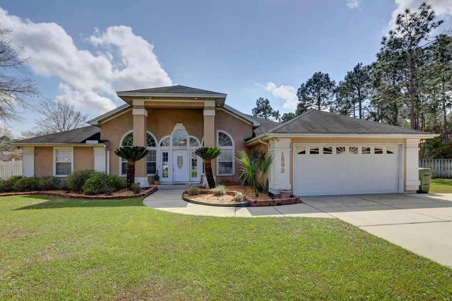 Great floor plan! Enter through the leaded glass front door into the foyer with beautiful marble flooring, formal dining room  and an office with french doors, continue into the great room with plank hardwood flooring continuing into the breakfast area and fully equipped kitchen with breakfast bar, plenty of cabinets, pantry and granite counter tops. Laundry room leads to double garage. Split bedroom plan features an awesome master suite and spacious tiled bath, two additional bedrooms and full bath. This beautiful well maintained home has a large fenced yard. Conveniently located to shopping, schools and park.