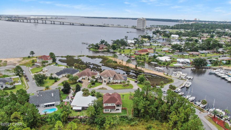 CURRENTLY UNDER CONTRACT, SELLER ACCEPTING BACKUP OFFERS

Stunning 2019 built custom home located in the gated waterfront community of Dolphin Bay in Panama City Beach.  Elegant design features and a great layout make this home a must see! 4 bedrooms, 3 1/2 baths PLUS an office space & bonus room make this the perfect home. Located on a oversized lot that is surrounded on two sides by a nature preserve that offer space and privacy. The kitchen is captivating and the flow to the family room & dining space with 10ft ceilings is spacious & inviting. 8 foot doors, shiplap and crown molding take this home to the next level. The stair railing design is a masterpiece by itself. This home has been meticulously maintained and you wont have to do a single upgrade with this beauty.