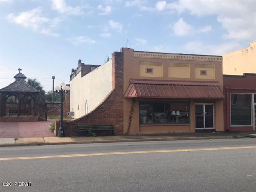 Great building to renovate in downtown Blountstown!  This 3892' building sits right next to a nice city square.  It has 2 bathrooms in the retail area.  This property also includes an apartment upstairs that is rented.  Hwy. 20 frontage and on-street parking!  Needs work and is eing sold 'As-Is'. SELLER SAID TO BRING ALL OFFERS!