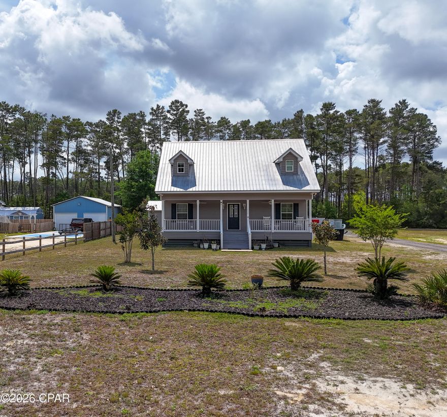 Welcome to your private coastal retreat, where comfort meets functionality and every detail is designed for entertaining and enjoying the outdoors. Built in 2017, this beautifully maintained 3-bedroom, 2.5-bath home offers an ideal layout with the primary suite, spacious living area, kitchen, laundry, and half bath all conveniently located on the first floor. The main home features warm pine flooring that adds character and a timeless coastal feel throughout. Upstairs, you'll find two generously sized bedrooms and a full bath--perfect for guests or family.

Step outside and the property truly shines. Expansive front and back porches invite you to unwind, while the thoughtfully designed outdoor living space is made for hosting. Enjoy a cooking pavilion, dedicated bar area, and hot tub--creating the ultimate setting for gatherings after a day on the water.

Fishing enthusiasts will appreciate the deeded private access to a boat launch and fishing dock on Black Creek, with direct access leading out to Choctawhatchee Bay. Whether it's an early morning cast or sunset cruise, this location delivers.

The property also features a detached mother-in-law suite complete with its own bedroom, kitchen, lounge space, and full bath, finished with durable and stylish oak flooring--ideal for guests, rental potential, or multigenerational living. Additional highlights include covered parking for two, a walk-in cooler for your fresh catch, and a backyard dotted with lemon, olive, peach, and fig trees.

All of this, just 20 minutes from the sugar-white sands of Grayton Beach and 25-35 minutes to premier shopping and dining at Sandestin and Destin Commons. No HOA!

This is more than a home--it's a lifestyle centered around coastal living, effortless entertaining, and quick, convenient access to some of the area's best boating and fishing waters.