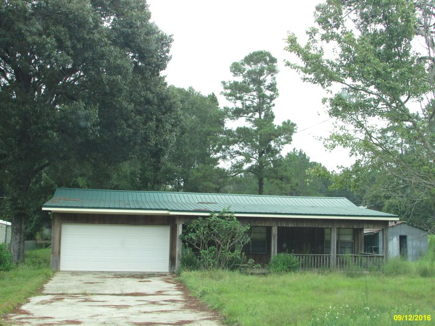Cute 2 Bedroom 2 bath home ready for you to move right into!! 1548 sq ft on 1/2 acre located on Hwy 90. 1 Car attached garage, ceiling fans, metal roof. No carpeting in the home only wood laminate and vinyl flooring. This home will not last long so call today for your personal showing!!!